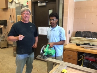 Doug Enz and a student from Bishop McNamara High School